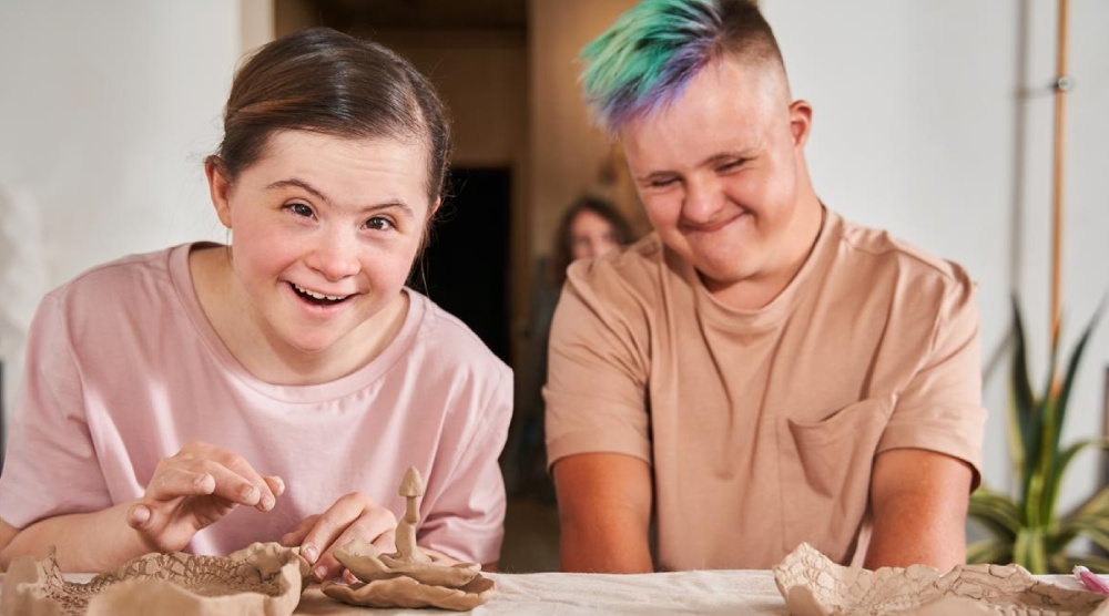 Boy with down syndrome smiling