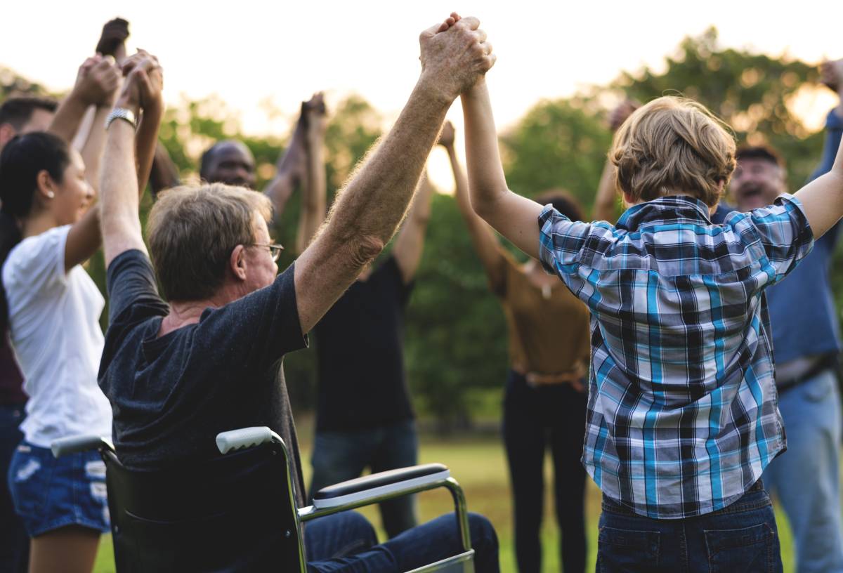 Group of people holding hand together